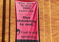 A banner on the exterior wall of United Church of Christ