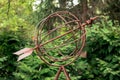 Frederik Meijer Gardens - Grand Rapids, MI, USA - September 15th 2019: Close up of an arrow flying through a globe statue