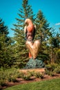 Frederik Meijer Gardens - Grand Rapids, MI /USA - September 4th 2016: Parrot and a golden heart statue at the Frederik Meijer Gar