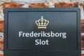 Frederiksborg castle, a danish sign and royal crown at the entrance Royalty Free Stock Photo