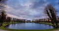 Frederiksborg castle on the sunset, with pond surrounded with trees in the foreground, Hillerod, Denmark