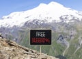 Free bleeding symbol. Concept words Free bleeding on beautiful black chalk blackboard. Beautiful mountain Elbrus blue sky