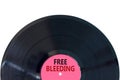 Free bleeding symbol. Concept words Free bleeding on beautiful black old retro vinyl disc. Beautiful white table white background