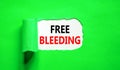 Free bleeding symbol. Concept words Free bleeding on beautiful white paper. Beautiful green table green background. Gen Z,