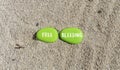 Free bleeding symbol. Concept words Free bleeding on beautiful green stone. Beautiful sea sand beach background. Gen Z,