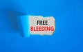 Free bleeding symbol. Concept words Free bleeding on beautiful white paper. Beautiful blue table blue background. Gen Z,