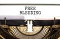 Free bleeding symbol. Concept words Free bleeding typed on beautiful old retro typewriter. Beautiful white paper background. Gen Z