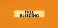 Free bleeding symbol. Concept words Free bleeding on wooden stick. Beautiful orange table orange background. Gen Z, motivational,