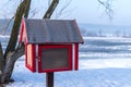 Free book sharing mini house near the river in cold winter morning Royalty Free Stock Photo