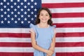 Free born and free bred. Carefree small child enjoying happy childhood. Happy little girl smiling on american flag decor
