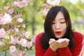 Free careless causual beauty girl with flowers in spring park enjoy free time