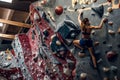 Free climber female bouldering indoors. Royalty Free Stock Photo