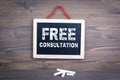 Free Consultation. Business success and customer service concept. Chalkboard on a wooden background Royalty Free Stock Photo