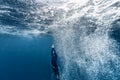 Free diver ascending from the depth