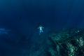 Free diver in the depth make bubble ring near USS Liberty Wreck