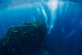 Free diver man dive at shipwreck and bubbles, underwater