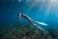 Free diver with white fins posing underwater. Freediving with young girl Royalty Free Stock Photo