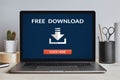 Free download concept on laptop screen on modern desk Royalty Free Stock Photo