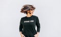 Free feeling happy smiling woman posing in black sweatshirt with positive print Shine On. She rotating a head bacause a cheerful Royalty Free Stock Photo