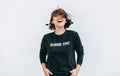 Free feeling happy woman posing in black sweatshirt with positive print Shine On Royalty Free Stock Photo