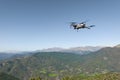 Free flight of a UAS Drone in the background mountains