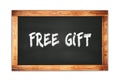 FREE GIFT text written on wooden frame school blackboard