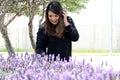 Free, happy, Latin adult woman in harmony and freedom, amid lavender flowers enjoying their beauty and aroma in a moment of relaxa Royalty Free Stock Photo