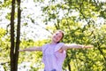 Free Happy Woman Enjoying Nature in a forest. Beauty Girl Outdoor. Freedom concept. Beautiful attractive Girl over Sky Royalty Free Stock Photo