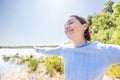 Free Happy Woman Enjoying Nature on a forest lake. Beauty Girl Outdoor. Freedom concept. Beautiful attractive Girl over Royalty Free Stock Photo