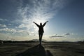 Free happy woman raising arms watching the sun Royalty Free Stock Photo