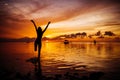 Free happy woman raising arms watching the sun Royalty Free Stock Photo
