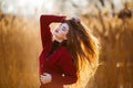 Free happy young woman. Beautiful female with long healthy blowing hair enjoying sun light in park at sunset. Spring Royalty Free Stock Photo