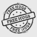 Free hugs rubber stamp on white. Royalty Free Stock Photo