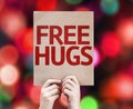 Free Hugs written on colorful background with defocused lights Royalty Free Stock Photo