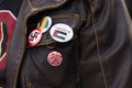 Free Palestine, Anti-Swastika, LGBTQ pins on activist jacket
