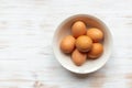 Free-range organic brown eggs in bowl on wood background with copy space Royalty Free Stock Photo