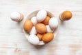Free-range organic brown and white eggs in bowl on wood background with copy space Royalty Free Stock Photo