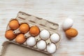 Free-range organic brown and white eggs in recycled cardboard box