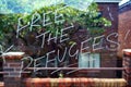 Free The Refugees, Graffiti On Glass Bus Shelter
