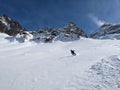 Freeride in powder snow in the ducan valley above davos. Big mountains in Switzerland. Ski touring mountaineering