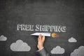 Free shipping concept on blackboard Royalty Free Stock Photo