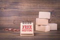 Free shipping concept. Paper boxes on wooden background Royalty Free Stock Photo