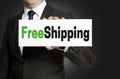 Free shipping sign is held by businessman