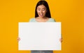 Free space for advertising. Asian girl holding empty board Royalty Free Stock Photo