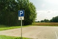 Free space Handicapped parking spot with green trees arround Royalty Free Stock Photo