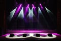 Free stage with lights, lighting devices, colored spotlights. Royalty Free Stock Photo