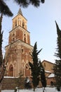The free-standing three-storey bell-tower in Monastery of St. Nino at Bodbe in winter
