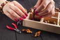 Free time evening making beads. Woman leisure home work, masterclass concept Royalty Free Stock Photo