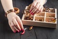 Free time evening making beads. Woman leisure home work, masterclass concept Royalty Free Stock Photo