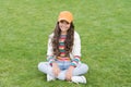 Free time spending. beauty and fashion. beautiful student teen girl in park. cute smiling confident schoolgirl relax on